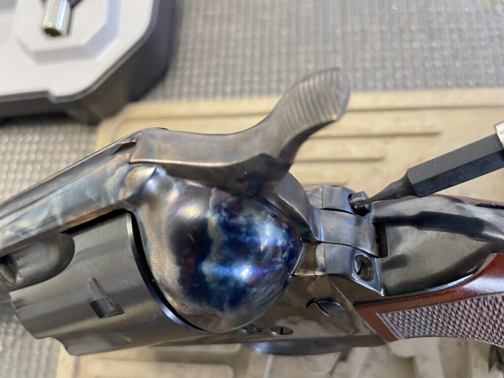 removing back strap screw on saw revolver