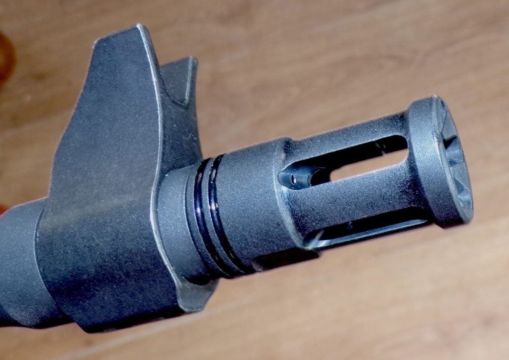 AR-style front sight and flip rear aperture on Ruger Scout rifle